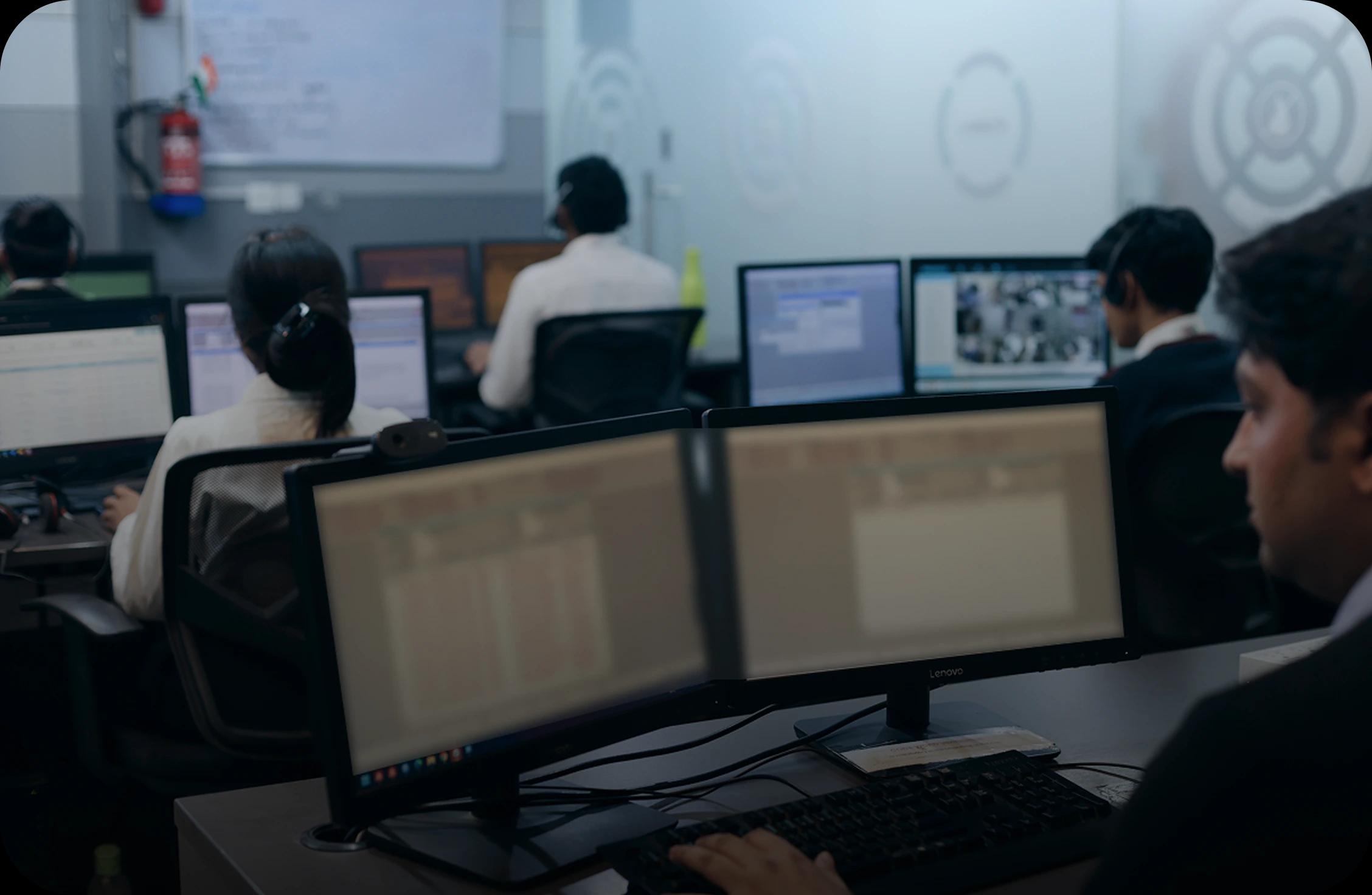 Main Control Room Image: Security operators in a control room monitoring real-time security data.